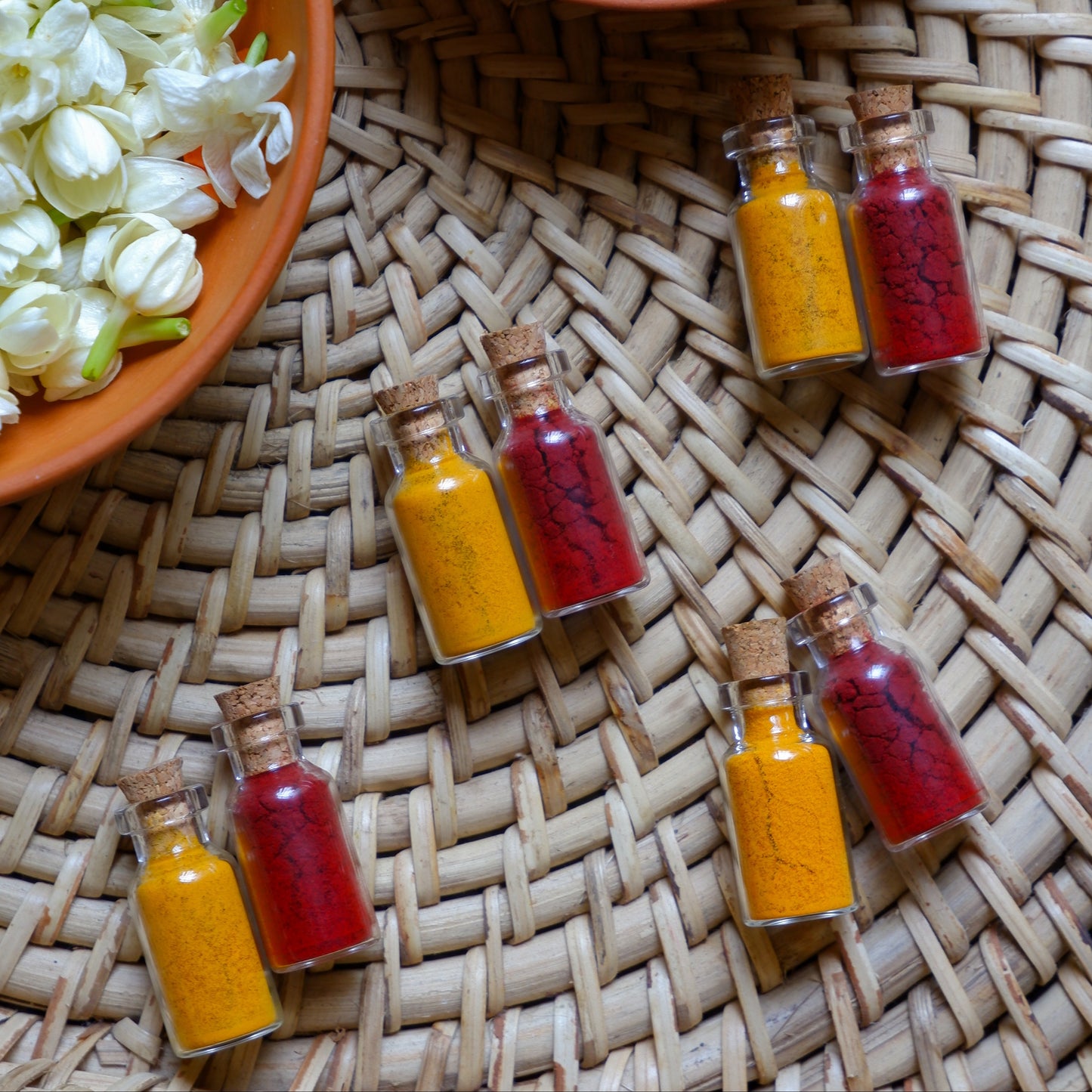 Traditional haldi kumkum set in small glass bottles for guests