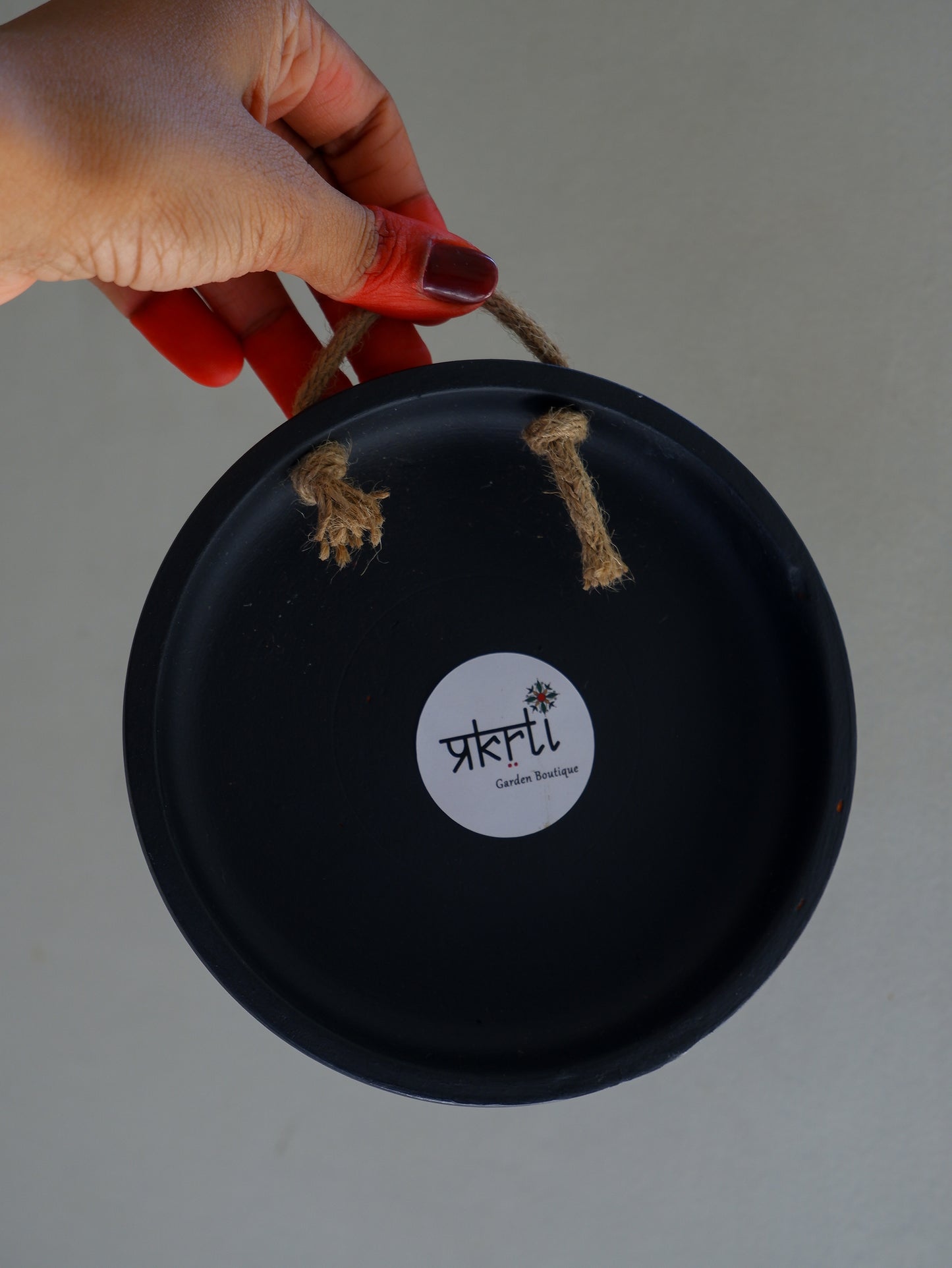 back view of 6 inch black Traditional South Indian Sikku Kolam Terracotta Wall Plates for Indian Homes