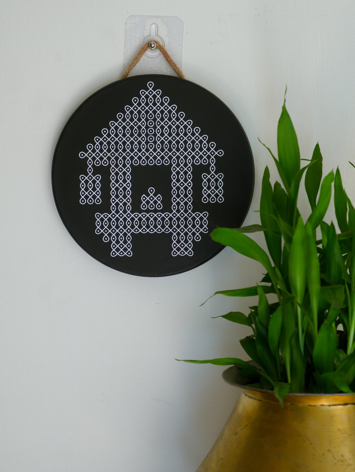 wall hanging image of 8 inch black Ther Traditional South Indian Sikku Kolam Terracotta Wall Plates for Indian Homes