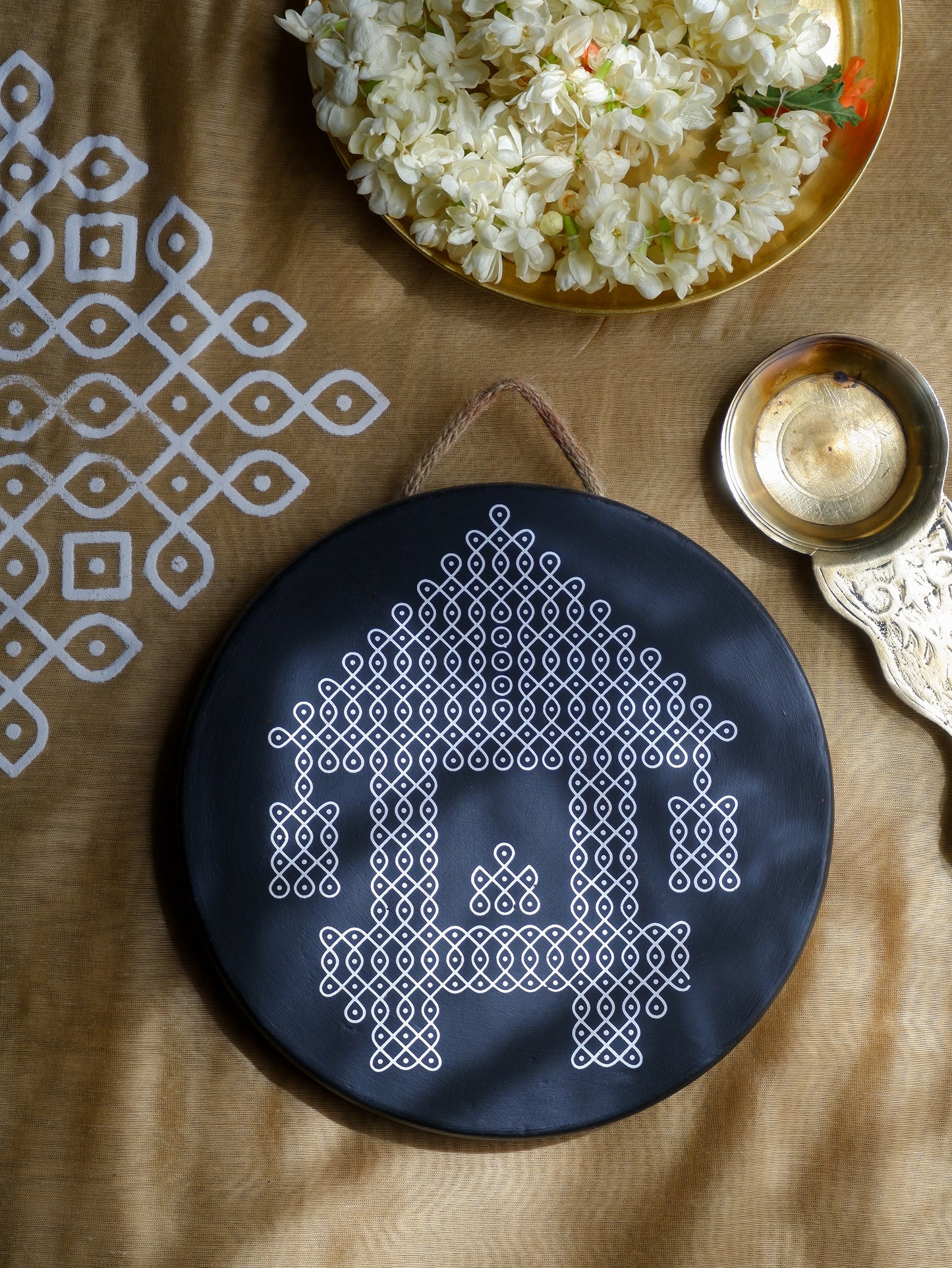 flat lay image 8 inch black Ther Traditional South Indian Sikku Kolam Terracotta Wall Plates for Indian Homes