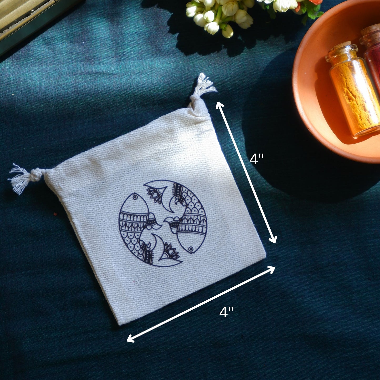 Close up of Madhubani art print on cotton pouch