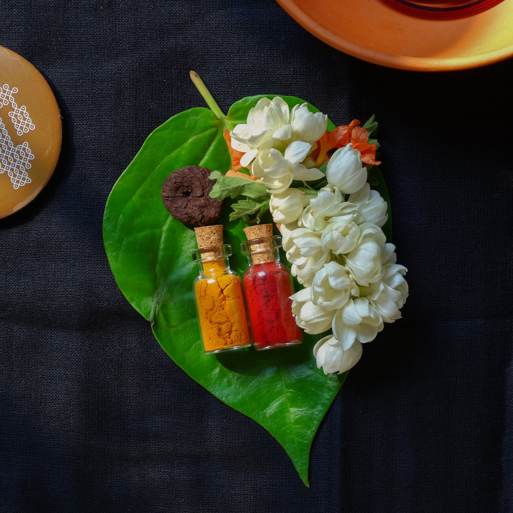 Mini glass bottles with haldi turmeric and kumkum traditional Indian return gifts