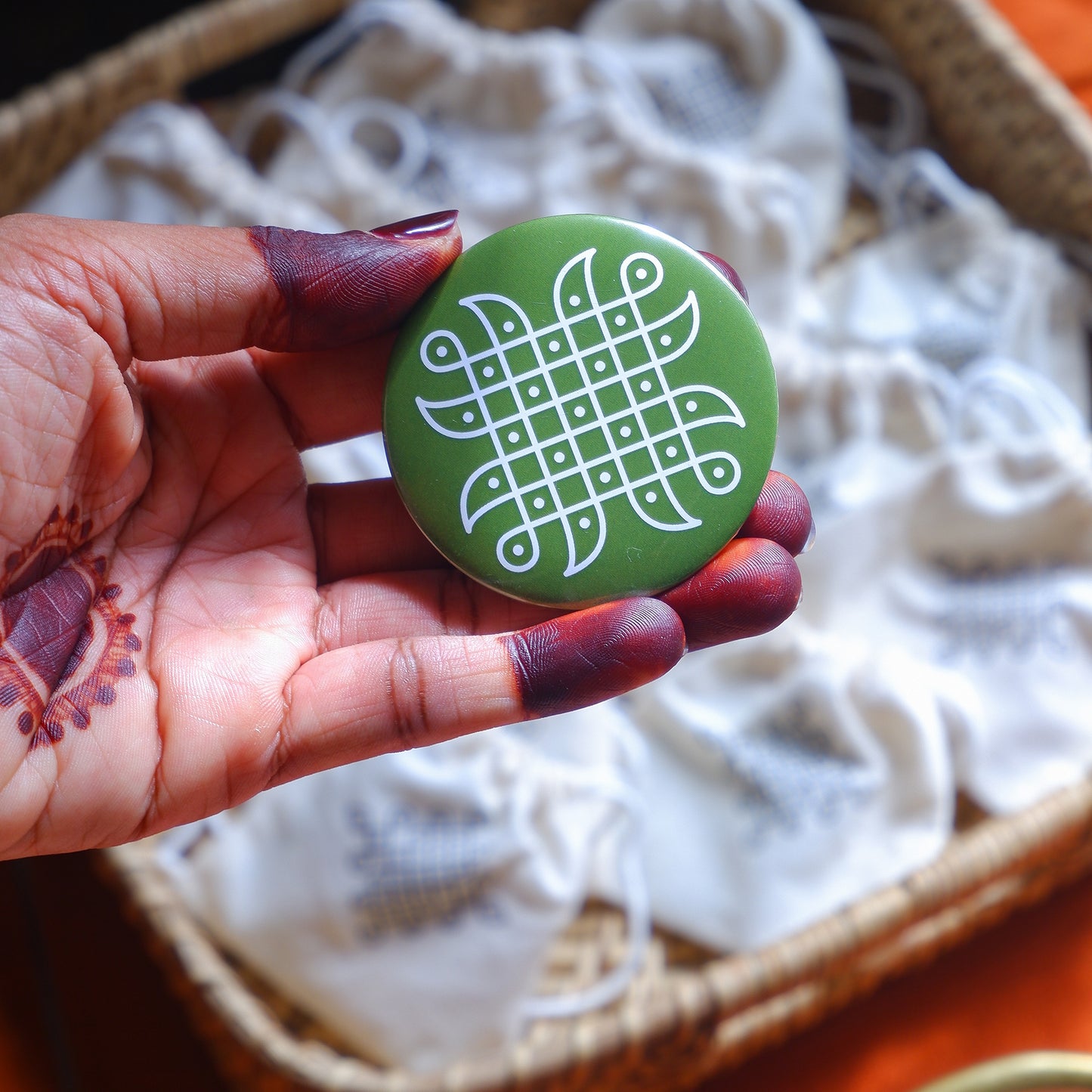 green fridge magnet with traditional South Indian Kolam design