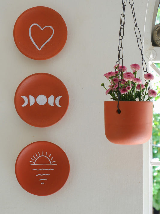 6-inch round unpainted terracotta wall plate with smooth surface for DIY painting or home decor.