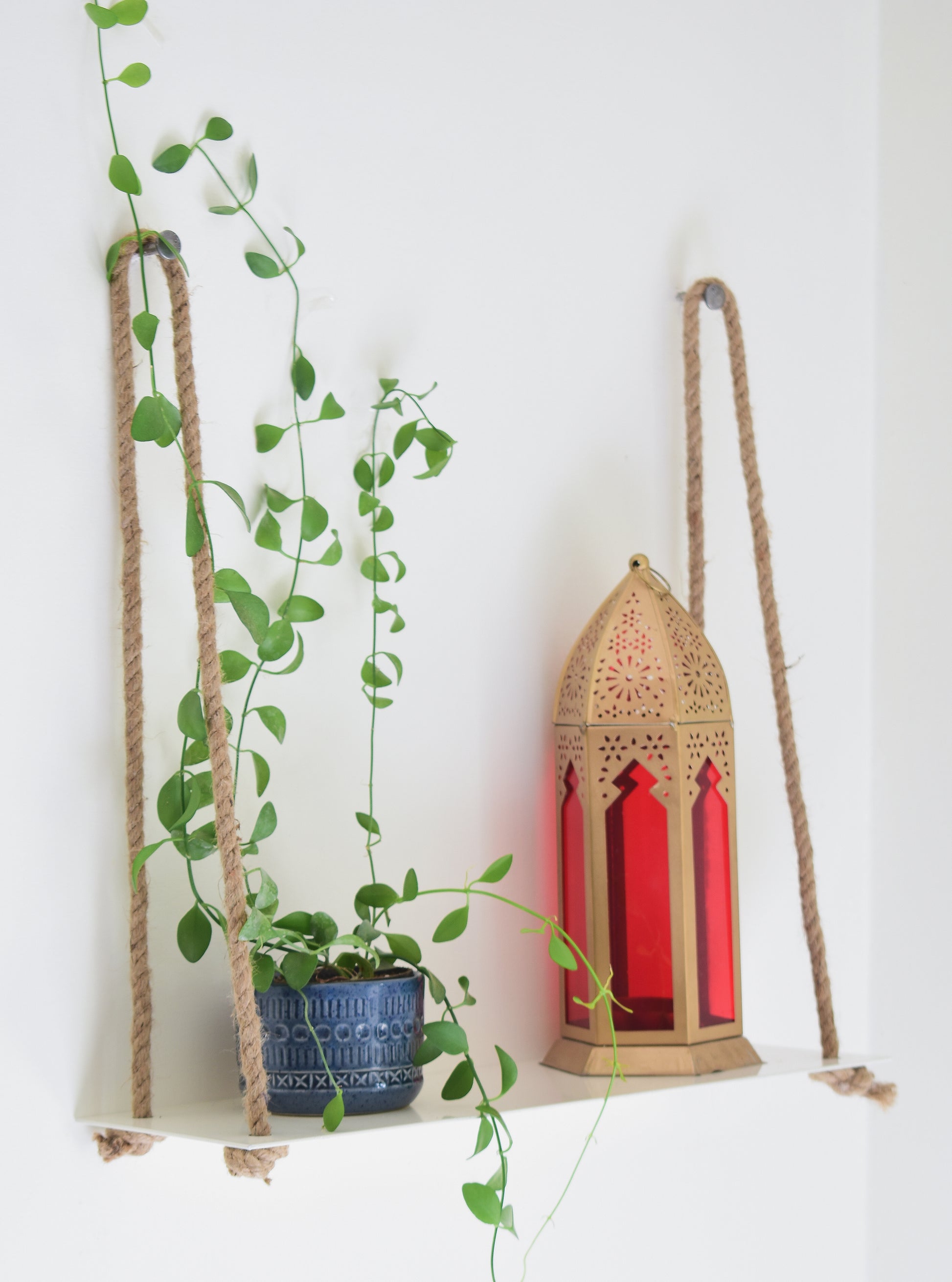 Shop white Hanging Metal Shelf to display plants. Delivered all India